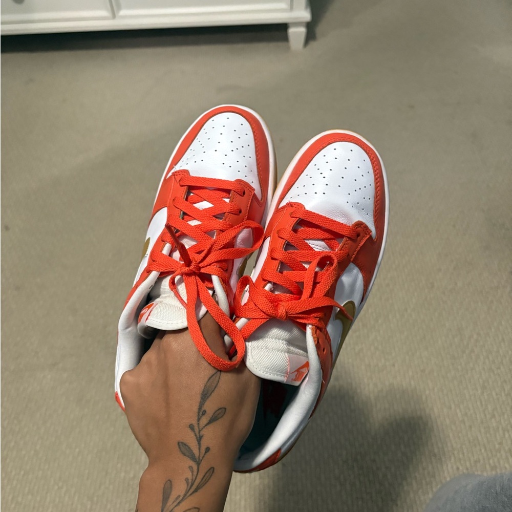 Women’s Nike Dunk Low White and Orange Sneakers